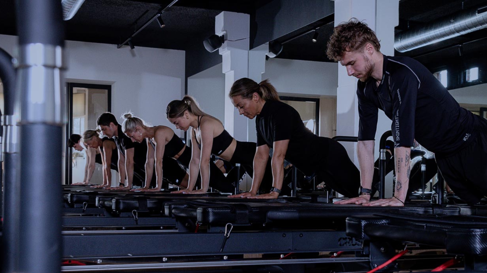 People training on a pilates reformer during a high-intensity class at CRUSH Studios in Haarlem