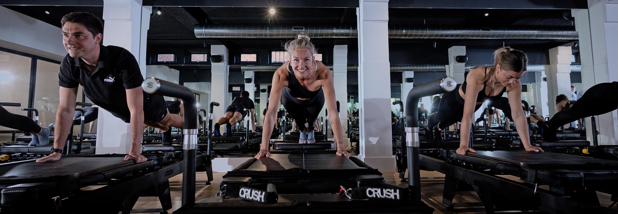 Woman training consistently on a pilates reformer at CRUSH Studios in Haarlem