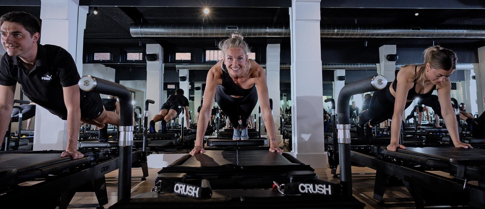 Woman training consistently on a pilates reformer at CRUSH Studios in Haarlem